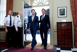 Prime Minister David Cameron with the Deputy Prime Minister Nick Clegg walk into Number 10 Downing St: courtesy of Conservative Party photostream