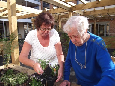 Beattie spends time gardening with EachStep support worker Ruth Pilling