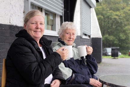 EachStep home care support worker Dianne Crossley and Beattie enjoying a cup of tea in the local park 