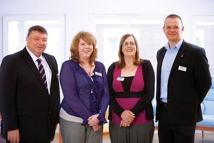 Maizie Mears-Owen, head of dementia care at Care UK, with three new dementia trainers