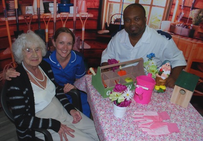 Patient Minnie Heys with ward sister, Rhiannon Lloyd and RAID/OP Liaison Practitioner Ash Akoumah in the vintage shed inspired RemPod