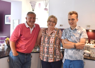 A home from home: Dean with his Shared Lives' carers Phil and Wendy.