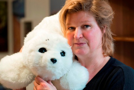 Dr Dodds with PARO