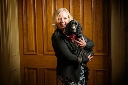 Deborah Meaden with a hearing dog
