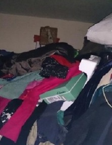 Cornwall Council image of a woman’s bedroom stacked almost to the ceiling