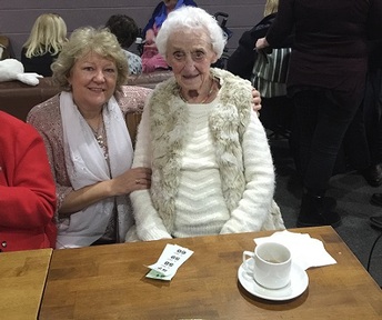 L-R:Home care worker Barbara with client Lorna at Home Instead Senior Care Rugby's social event for clients