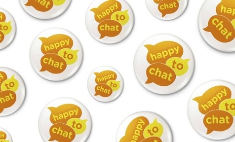 Happy to chat badges were handed out at transport hubs across London on the day of the launch