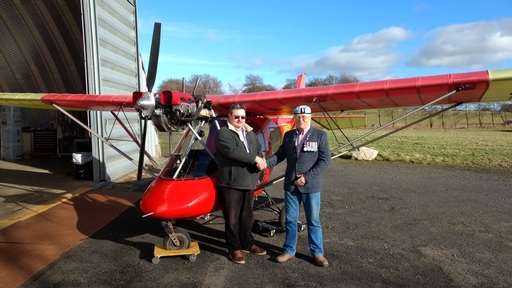 Roddy Kyle with flying instructor