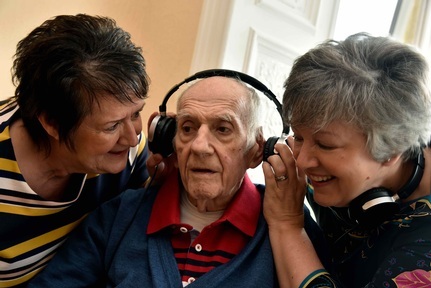 Listening to a music playlist at Abbeyfield Stow Park