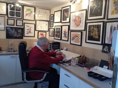 Arthur Ellis surrounded by his art