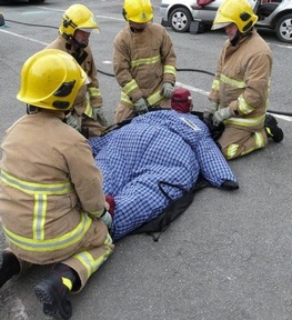 Firemen practise rescuing bariatric mannequin  Credit: Ruth Lee