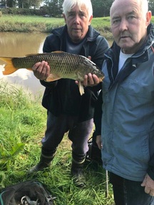 John Sowden fishing with home care worker Chris Round