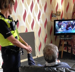 Police officers offering the hand of friendship - Ladywood Police