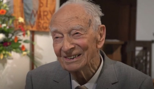 100 year-old Dennis Brock joins fellow bell ringers.