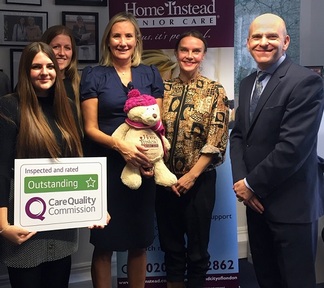 Care minister Caroline Dinenage with Home Instead Senior Care staff. Credit: Home Instead Senior Care