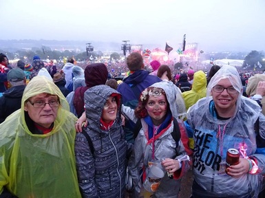 Revelers enjoying rain at the festival