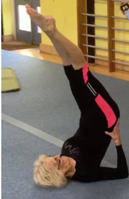 Marjorie Scholes demonstrates her flexibility on the floor. Credit: Marjorie Scholes.
