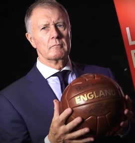 Sir Geoff Hurst holding a signed England football.   Credit: Youtube