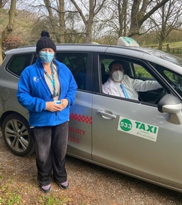 Taxi driver Kelvin Pottinger with Bluebird Care care worker. Credit: Bluebird Care