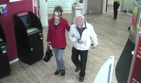 Veronica Robinson with her victim in his bank where he withdrew money and gave it to her.