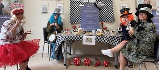 A Mad Hatter’s Tea Party in Carefound Home Care office in Harrogate, Yorkshire. Credit: Carefound Home Care