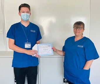 Ben Beddall being presented his 'outstanding contribution' award