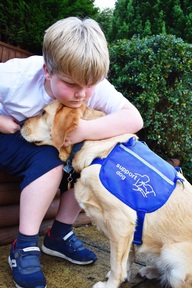 JJ Gilman and his dog Berry. Credit: Support Dogs.
