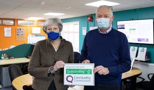 Theresa May with owner Scott MacRae. Credit: Right at Home.