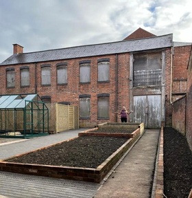 Charlotte Johnson in the dementia sensory garden. Credit: Home Instead.