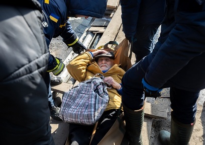 9 March 2022: Elderly man among Irpin's residents fleeing their homes as Russian troops bomb the Ukrainian city. Credit: Drop of Light/ Shutterstock