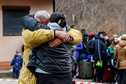 In Uzhhorod, Ukraine (February 26, 2022): Man says goodbye to his wife who is among refugees on the Ukrainian-Slovak border fleeing Russian aggression. Credit: Yanosh Nemesh/ Shutterstock