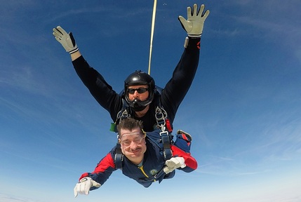 Mark Pike enjoying his skydive. Credit: Bluebird Care